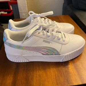 Size 8.5 white and silver Puma Carina Sneakers. New w/o box.